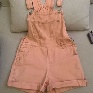 Pink denim overalls